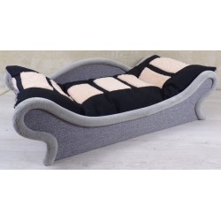 Un canapé-lit avec une armature grise  pour chien et chat muni d'un coussin noir et écru