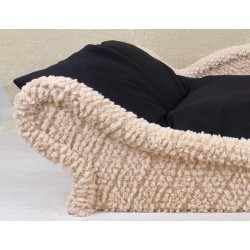 Photo de détail du canapé-lit pour chien et chat en tissu bouclette écrue avec un coussin noir en flocons de mousse